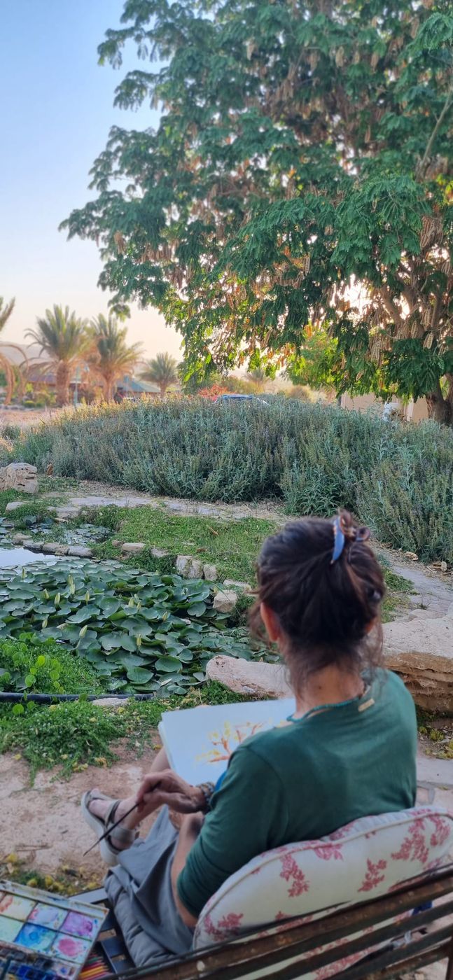 ציור בצבעי מים ליד בריכת הנופרים